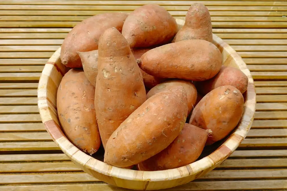 raw sweet potatoes in a basket